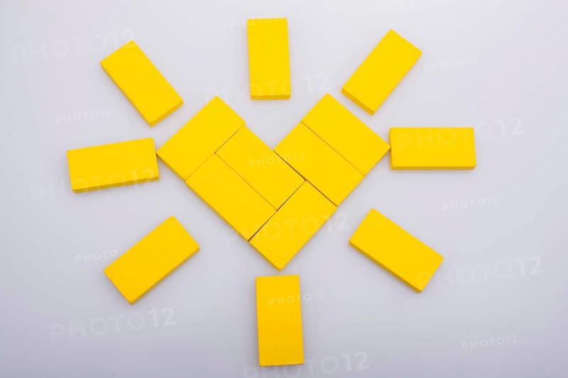 Colorful domino pices are forming a Sun shape