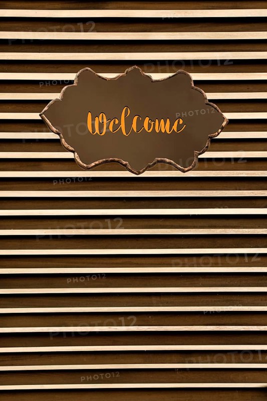 Welcome wording on sign board on background for business concept