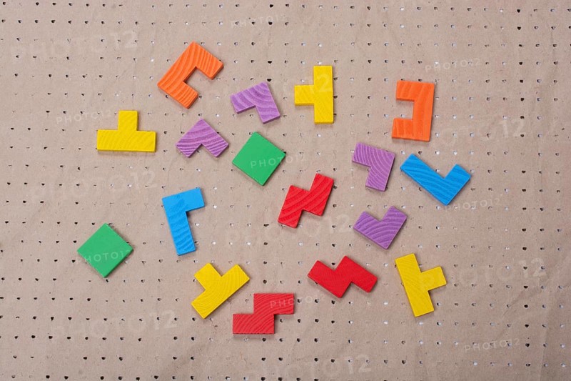 Concept of creative logical thinking. Different colorful wooden blocks. Geometric shapes in different colors