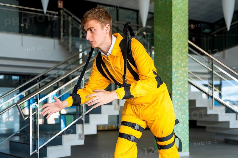 Employee with an exoskeleton from a futuristic high-tech warehouse