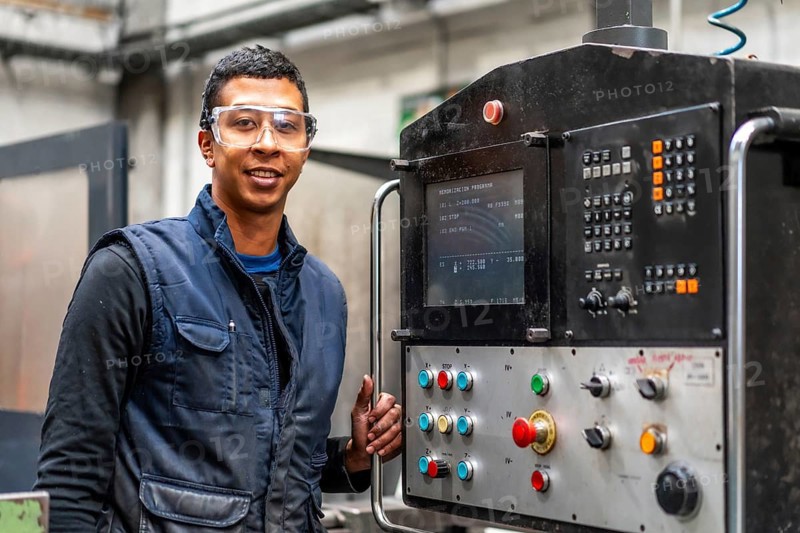 Latin worker operator of the metal industrial factory trade of the numerical control sector