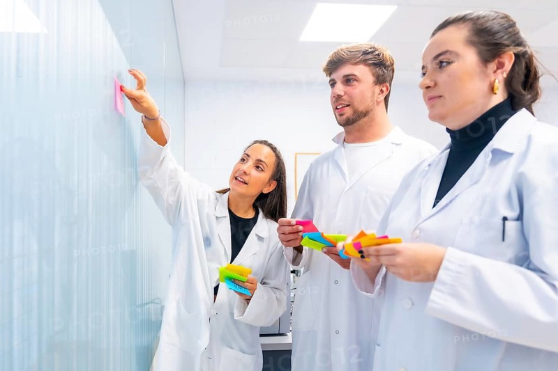Scientist during a brainstorm creative process in a cancer research lab