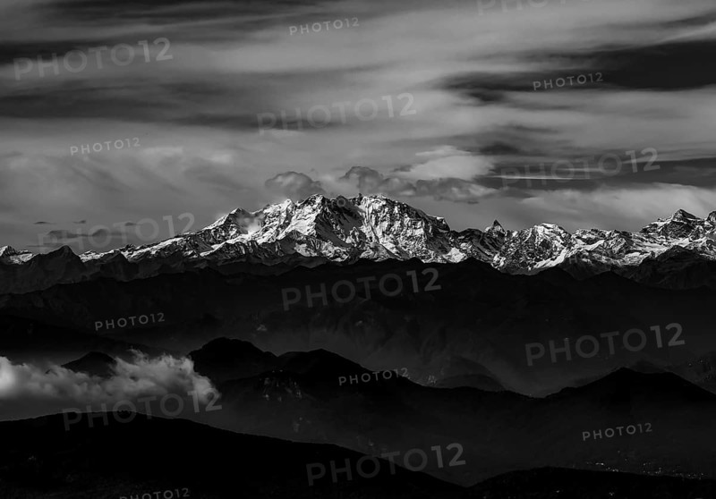 Aerial View over a Beautiful Mountainscape and And Snow Capped Monte Rosa and Mountain Peak Matterhorn and with Floating Clouds in a Sunny Day in Ticino