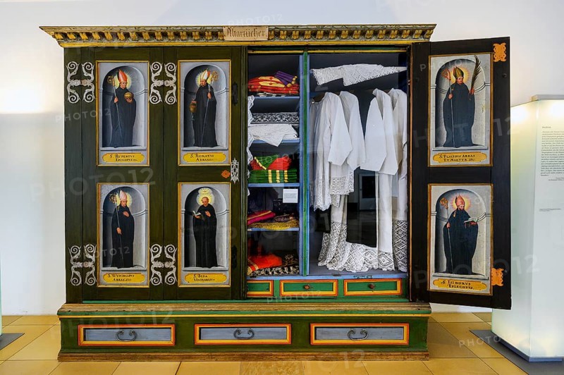 Cupboard with altar cloths and painted pictures of saints in the museum of the monastery