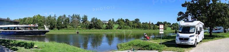 Panoramic photo with a motorhome in the motorhome parking area