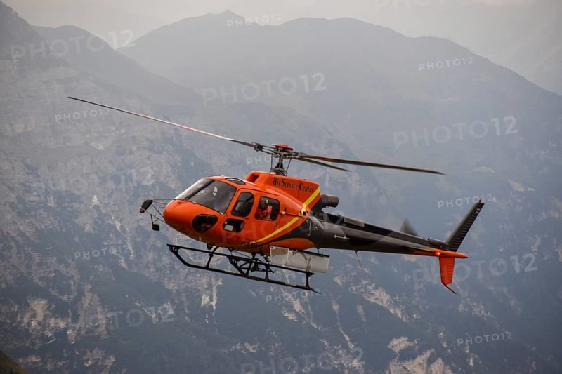 Aerospatiale 350B3 Ecureuil helicopter from the Air Service Centre on a supply flight to the Magdeburger Huette in the Stubai Alps