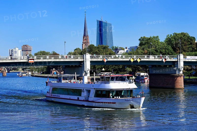 Tourist boat cruising in front of European Central Bank Building in the banking district