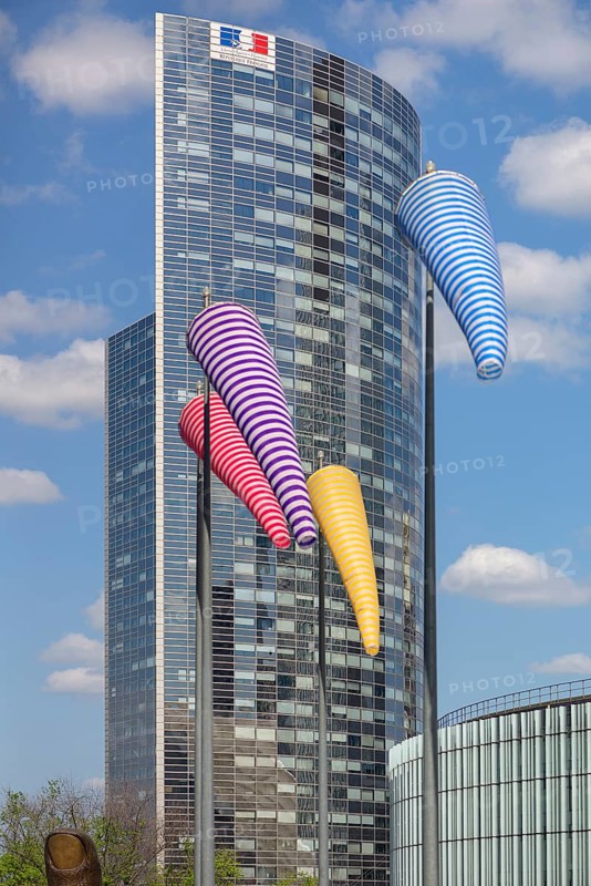 Office tower with colourful windsocks in front of it