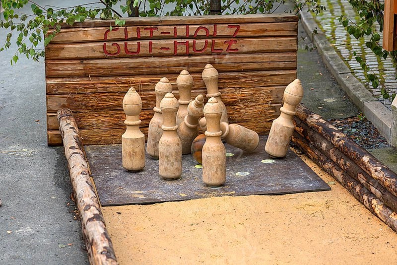 Historical sand skittle alley with wooden ball and wooden skittle