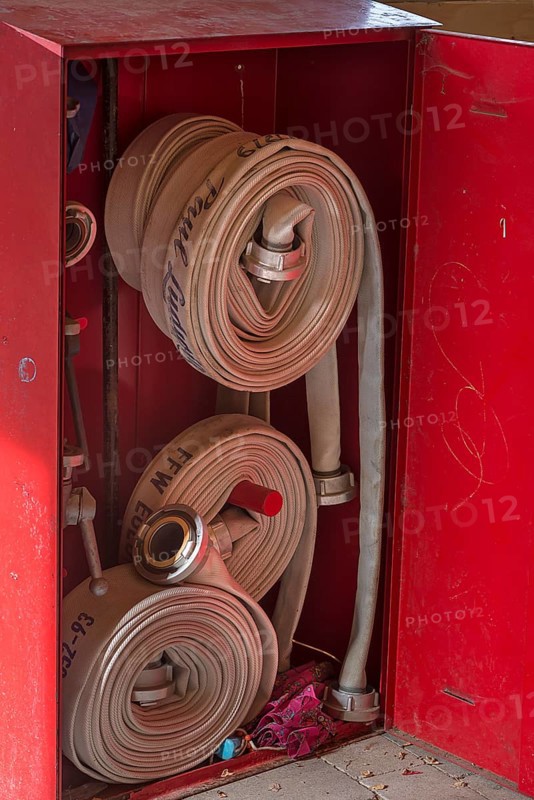 Cabinet with fire hoses from the volunteer fire brigade in a bus stop