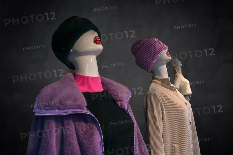Mannequins with knitted hats in a fashion shop