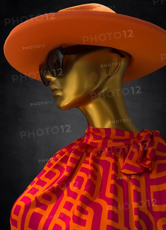 Mannequin with hat and sunglasses in a fashion shop