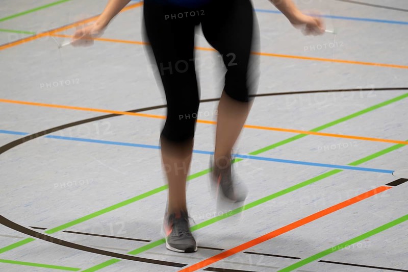 Woman rope skipping in a gymnasium