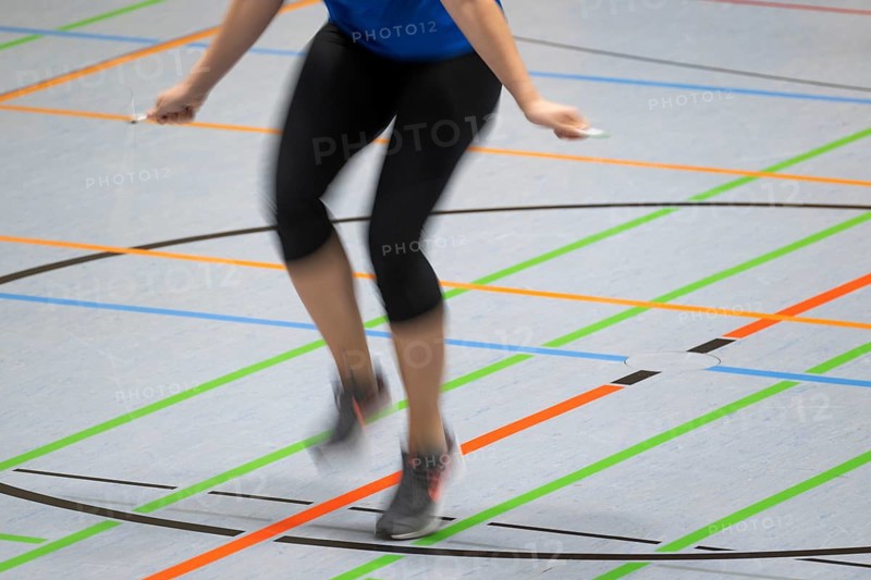 Woman rope skipping in a gymnasium