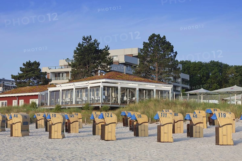 Restaurant and roofed wicker beach chairs along the Baltic Sea at Scharbeutz