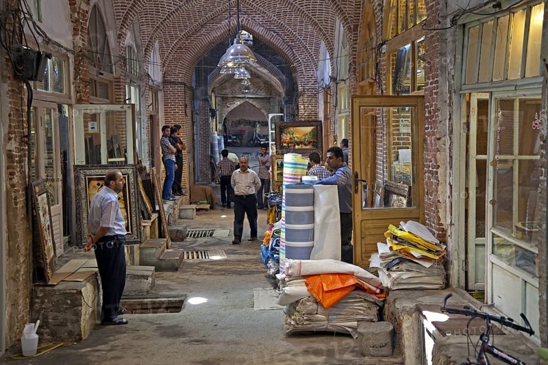 Antiques and fabrics for sale in shops in the old historic bazaar of the city Tabriz