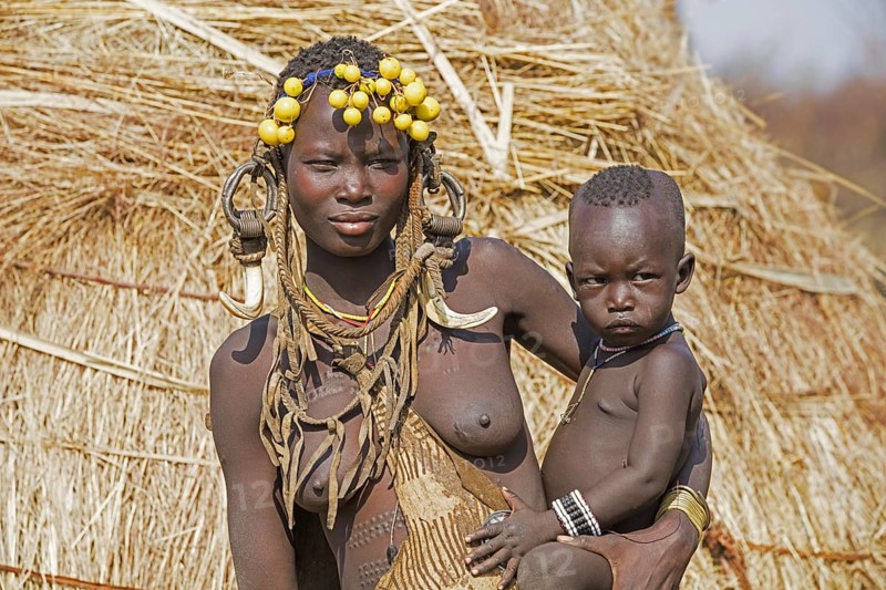 Black woman with child of the Mursi