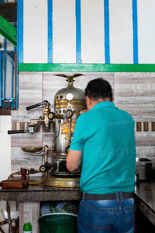 Preparing coffee on a historic espresso machine