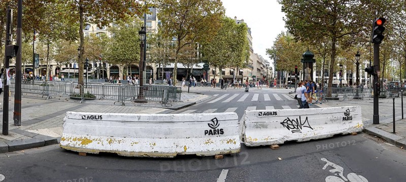 Concrete blocks of police prevent traffic on the Avenue Champs-Elysees