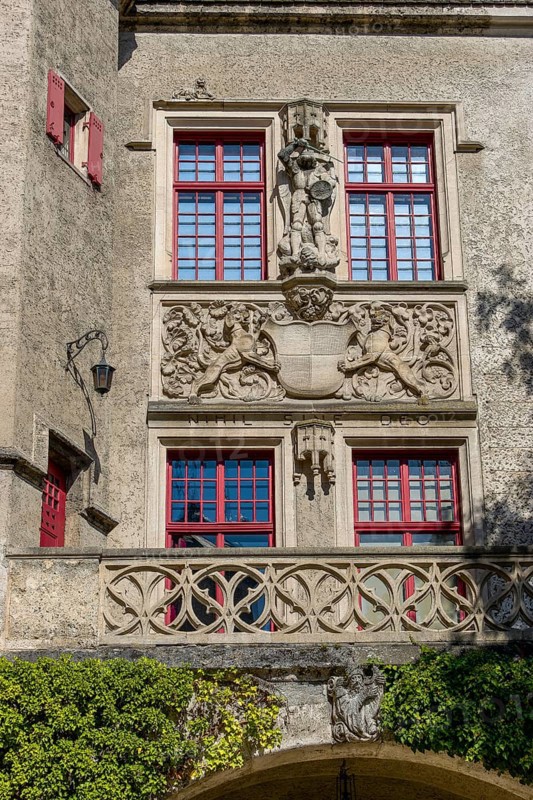 Detail of the magnificent facade with figures and coat of arms of the Hohenzollern Castle Sigmaringen