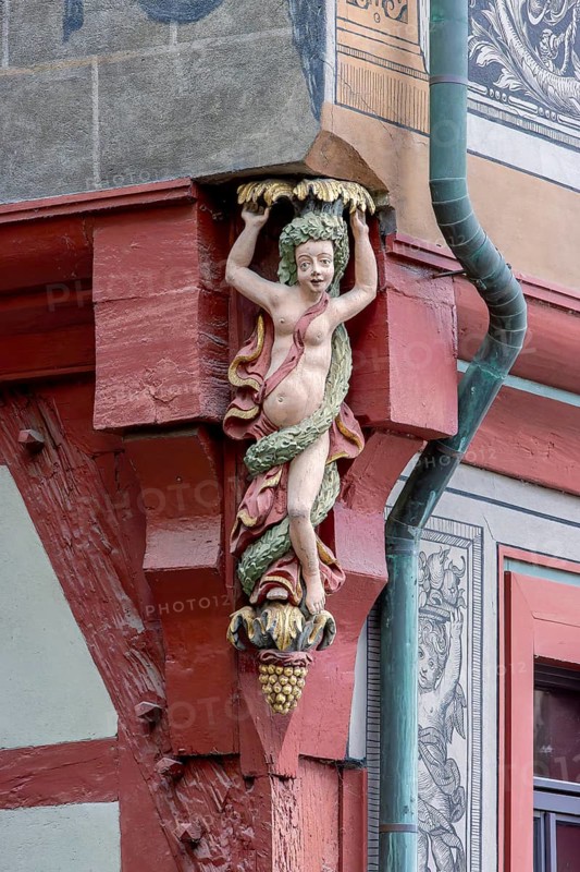 Detail of the corner of Tuebingen's historic town hall building with a carved female figure