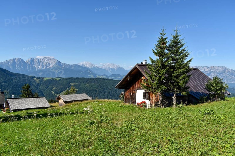 Alpine huts of the Spielbergalm with a view of the Berchtesgaden Alps with Hoher Goell