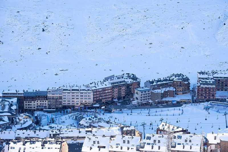 Aerial view of El Pas de la Casa in the snowy landscape in the Pyrenees mountains in Andorra