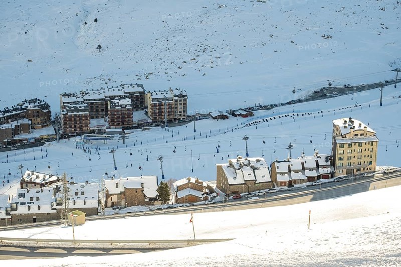 Aerial view of El Pas de la Casa in the snowy landscape in the Pyrenees mountains in Andorra