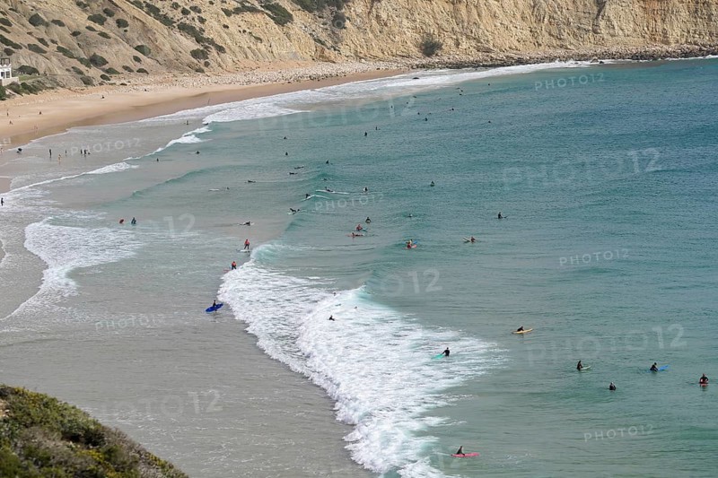 Surfers in the surf at Sagres beach