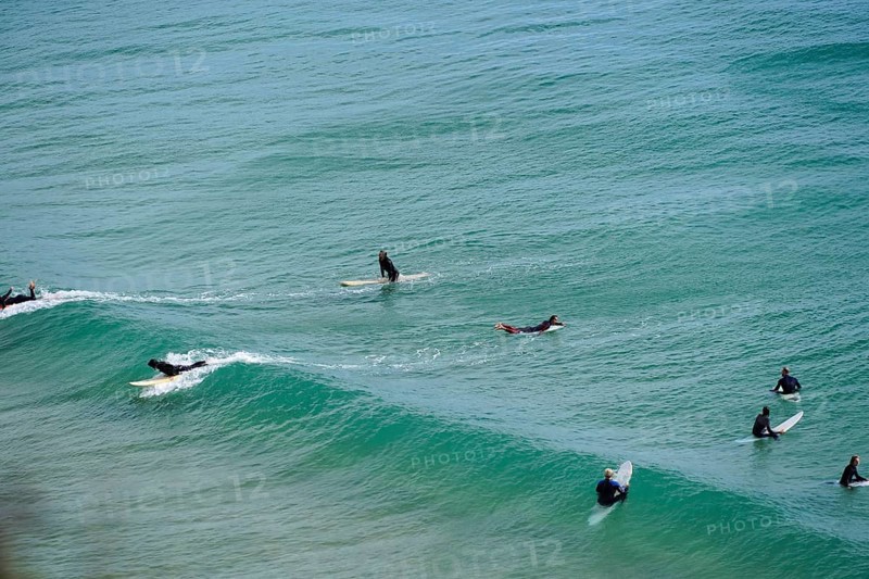 Surfers in the surf at Sagres beach