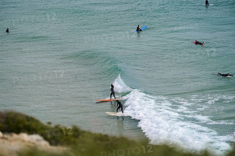 Surfers in the surf at Sagres beach