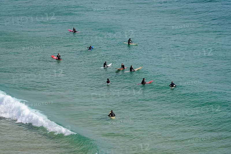 Surfers in the surf at Sagres beach