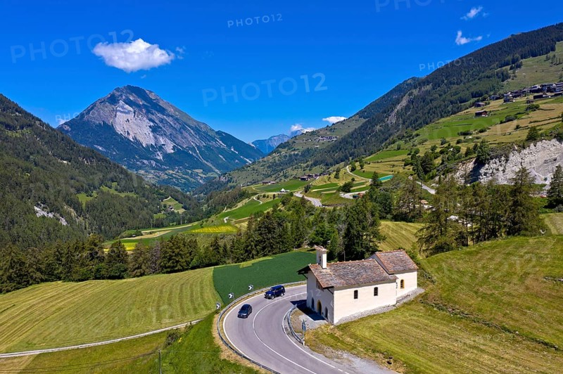 Summer landscape with Saint-Laurent chapel on the ascent to the Great St Bernard Pass