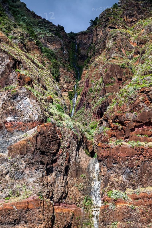 Volcanic cliff with waterfall