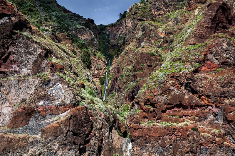 Volcanic cliff with waterfall