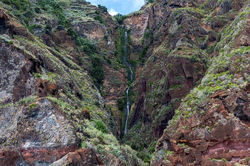 Volcanic cliff with waterfall