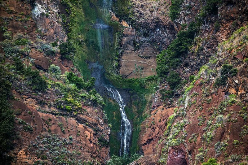 Volcanic cliff with waterfall