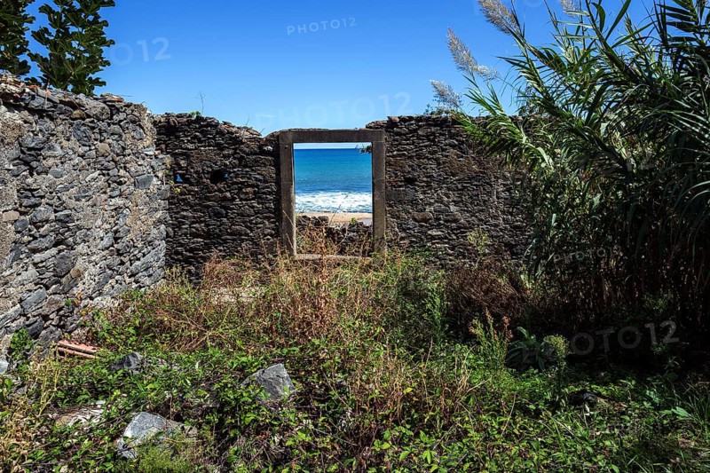 Crumbling wall with window frame