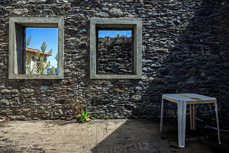 Crumbling wall with window frame