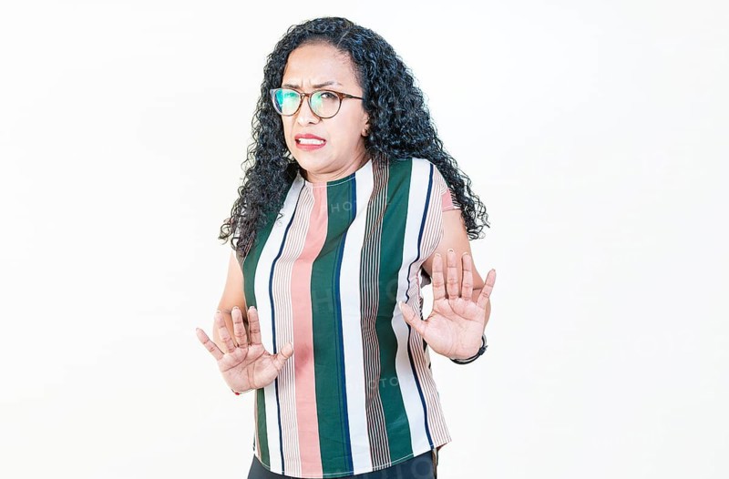 Afro woman with face disgusted on isolated background.. Woman in glasses with disgust face isolated
