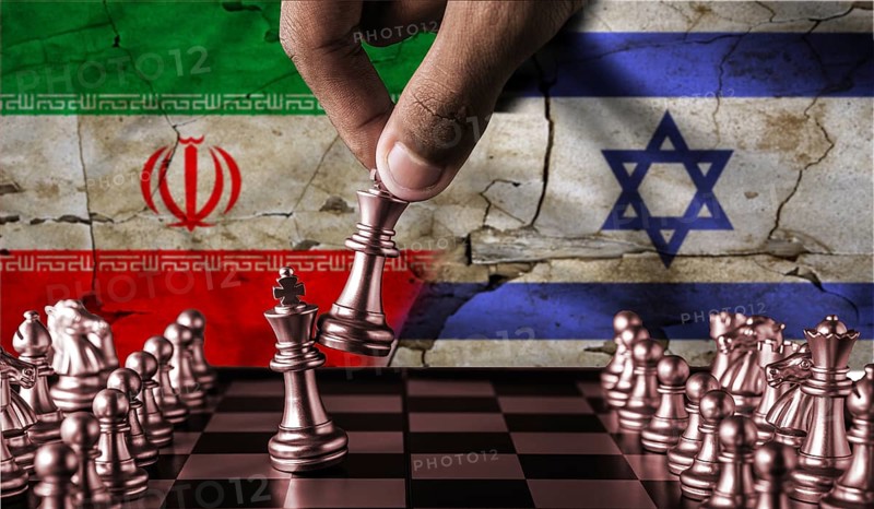 Israel vs Iran flag concept on chessboard. Political tension between Iran and Israel. Conflict between Israel and Iran on pieces of chessboard