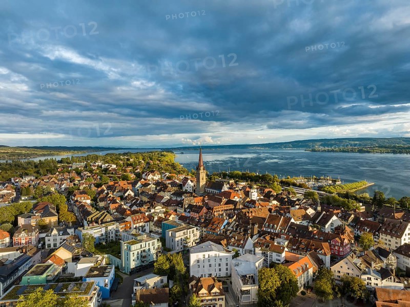 Aerial view of the town of Radolfzell on Lake Constance with the Radolfzell Minster in front of sunset