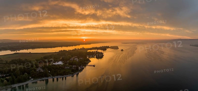 Aerial panorama of western Lake Constance at sunrise with the Mettnau peninsula