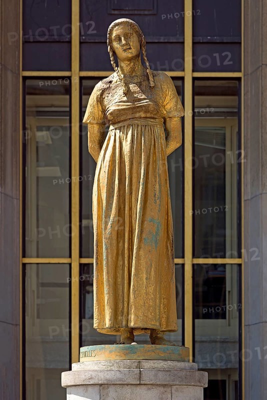 Golden female statue by Felix Alexandre Desruelles