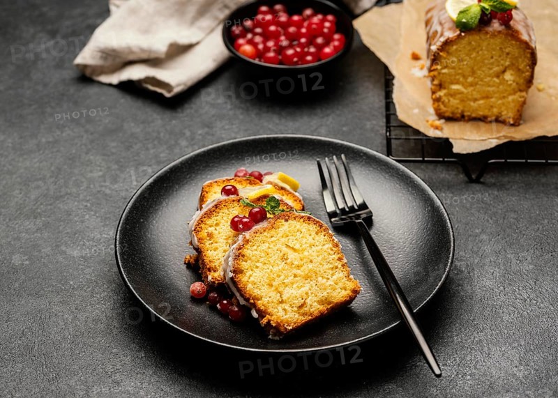 High angle cake slices plate with fork berries
