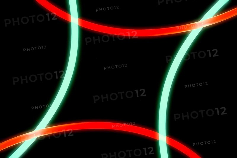 Illuminated red green curve lights black background