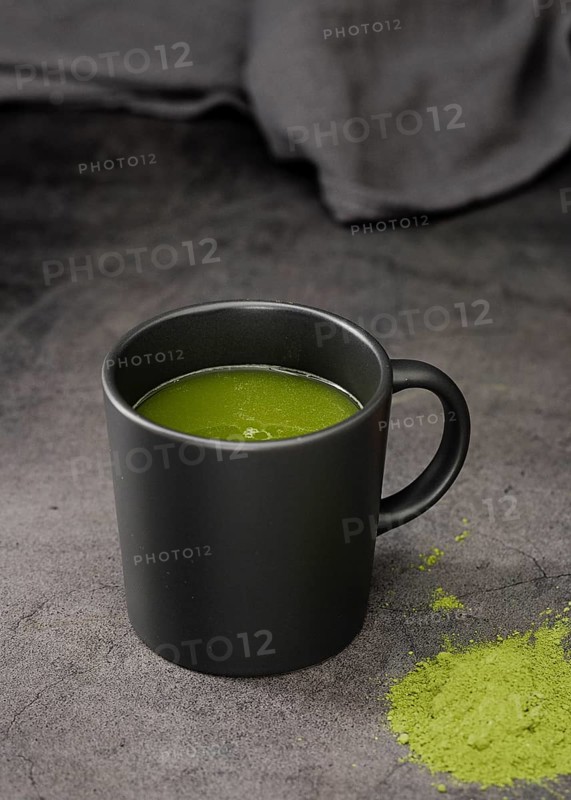 Matcha tea cup with powder