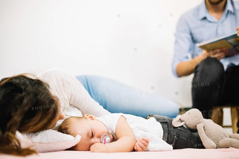 Mother sleeping floor with baby