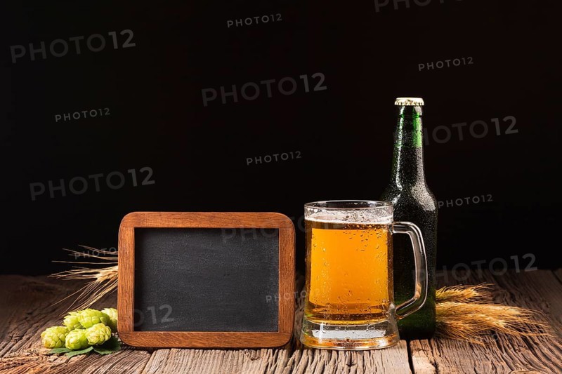 Mug bottle beer wooden background