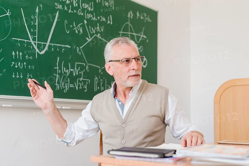Old teacher explaining lecture room